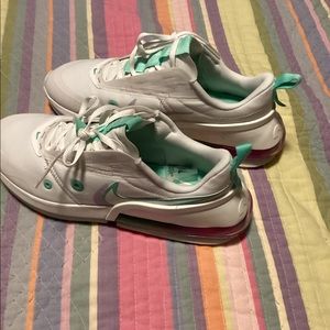Nike Woman’s Air Max Up shoes that are white with mint green.
